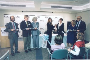 Jennifer and Rita cutting the ribbon at our program opening in 2003